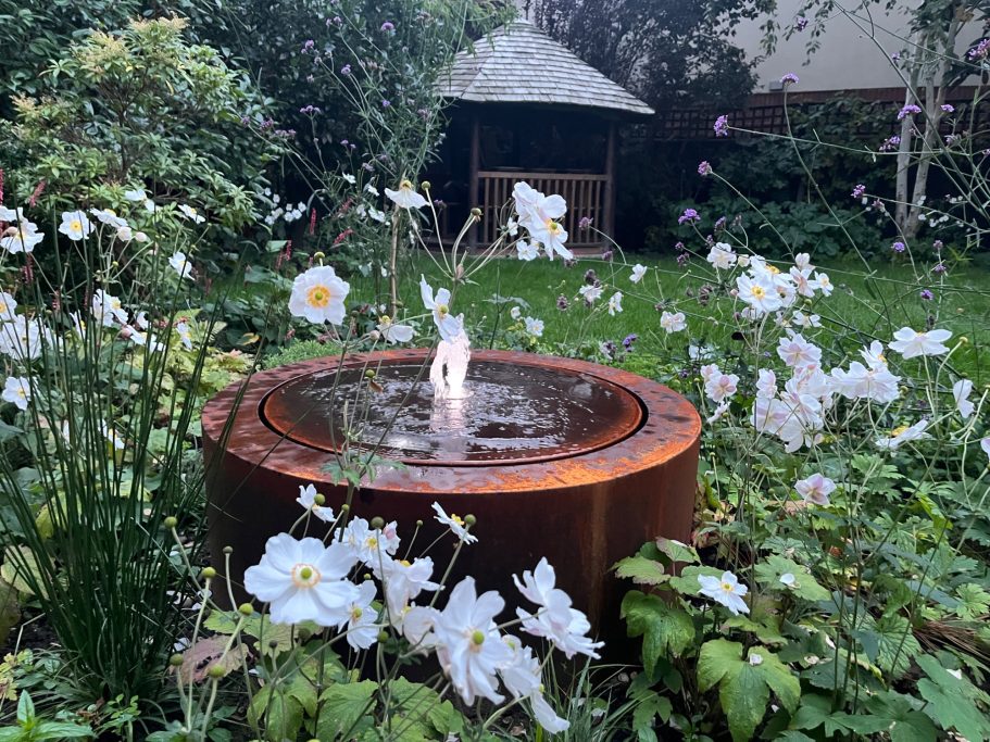 detail of planting with Corten water feature